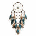 Attrape-rêves bohème avec plumes bleu, beige et marron
